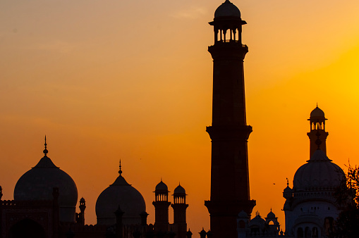 Sunset behind the world's largest Badshahi mosque
