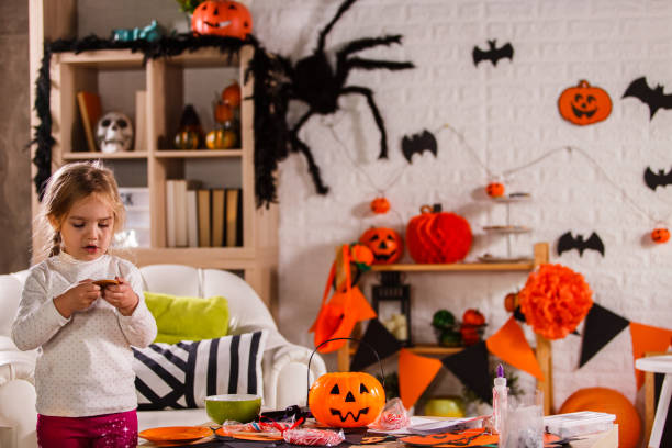istock Holding a cookie she got trick or treating 1284190193