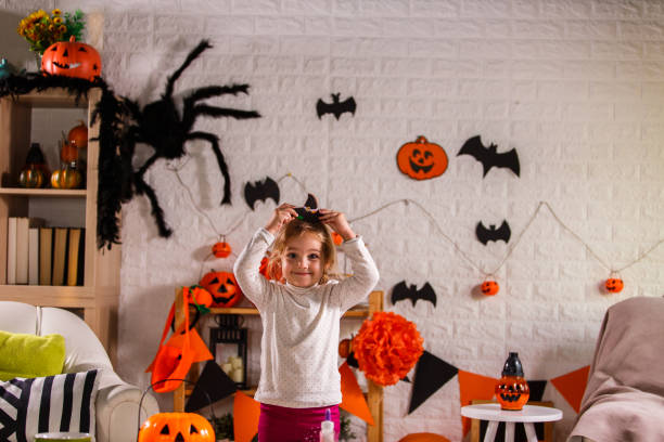 istock Excited little witch smiling at camera 1284190194