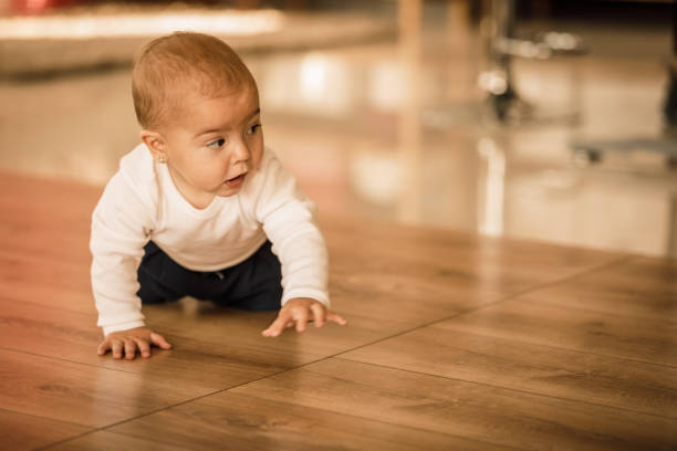 istock Baby crawling and exploring around the nursery 1284190240