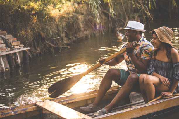 istock Adventurous couple on a rowboat 1284190251