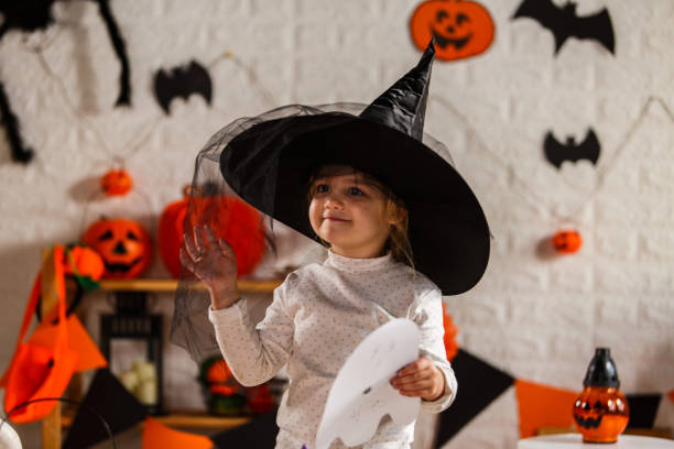 istock Playing witch dress up for Halloween 1284190504