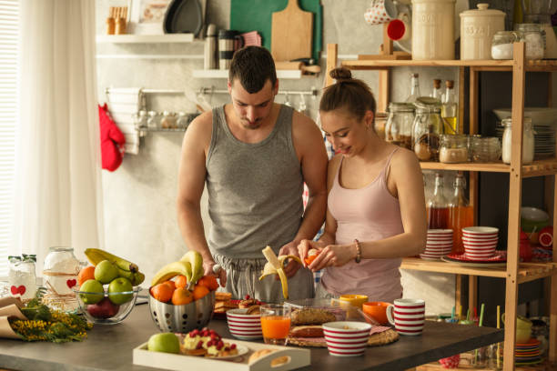 istock Couple making breakfast together during quarantine days 1284190535