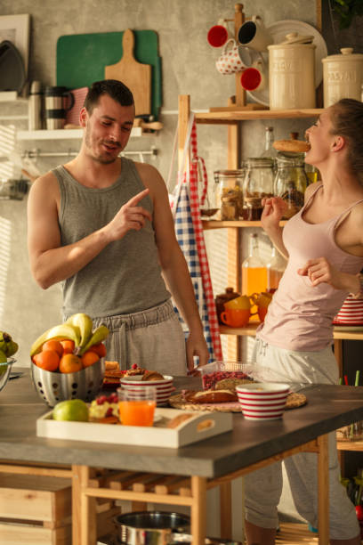 istock Young couple preparing breakfast together during quarantine days 1284190537