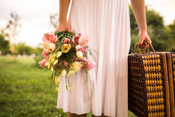 istock Carrying a wicker squared basket for a picnic 1284190596