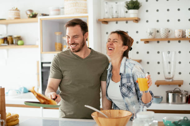 istock Husband and wife making pancakes at home 1284191975