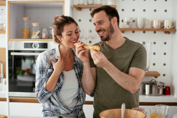 istock Husband and wife making pancakes at home 1284192126