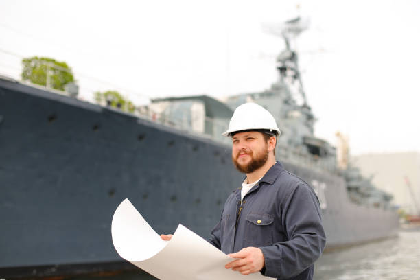 istock Maritime captain reading documents and standing near vessel 1284193493