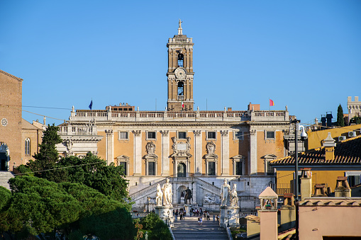 A view of the facade and the square of the Campidoglio (Capitoline Hill) in the heart of Rome, with the bronze copy of the majestic equestrian statue of Emperor Marcus Aurelius in the center. The square and the palace was designed by Michelangelo Buonarroti. The original statue of Marcus Aurelius is kept inside the Capitoline Museums. Currently the Campidoglio is the seat of the Municipality of Rome. Image in High Definition format