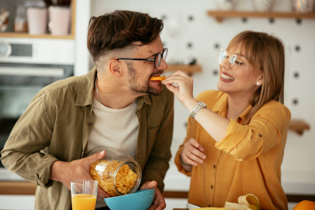istock Young couple eating breakfast at home. 1284194837
