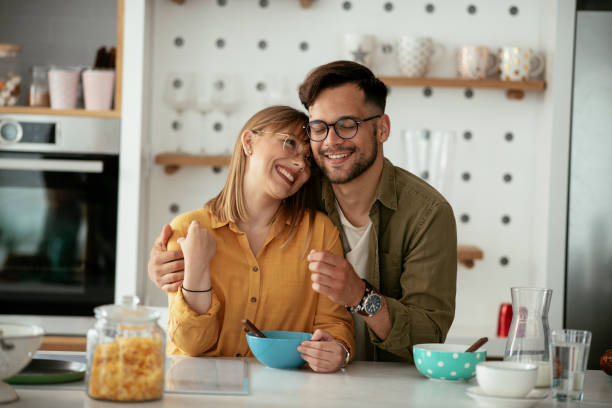 istock Young couple eating breakfast at home. 1284197017