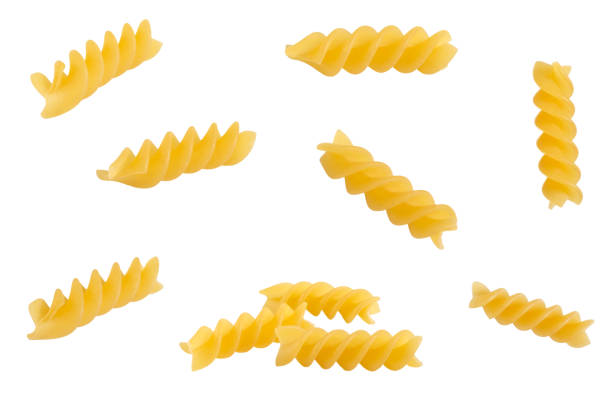 istock Uncooked Fusilli pasta isolated on white background 1284197544