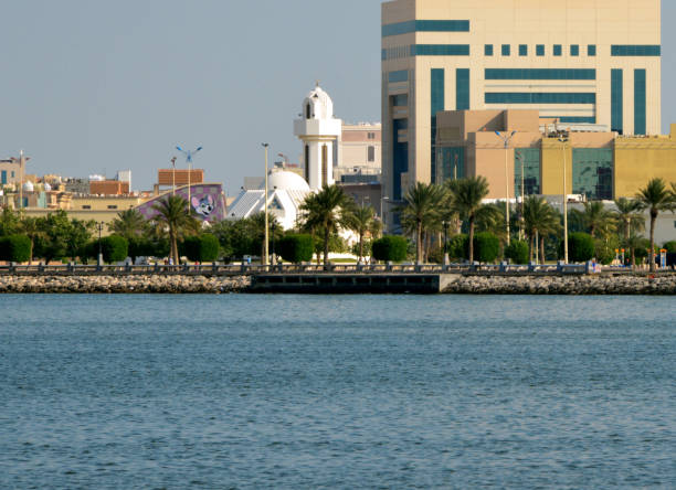 Saad Al Muammer Business Center and Al Essa and Al Dowayan Mosque, Dammam's cornice, Eastern Province, Saudi Arabia Dammam, Eastern Province, Saudi Arabia: waterfront park and buildings, Saad Al Muammer Business Center and Al Essa and Al Dowayan Mosque - Dammam's corniche on the Gulf dammam stock pictures, royalty-free photos & images