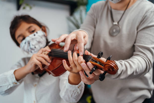 istock Violin class during corona virus pandemic 1284198682