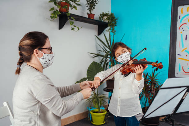 istock Violin class during corona virus pandemic 1284198683
