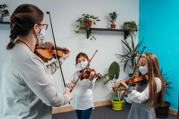 istock Violin class during corona virus pandemic 1284198686