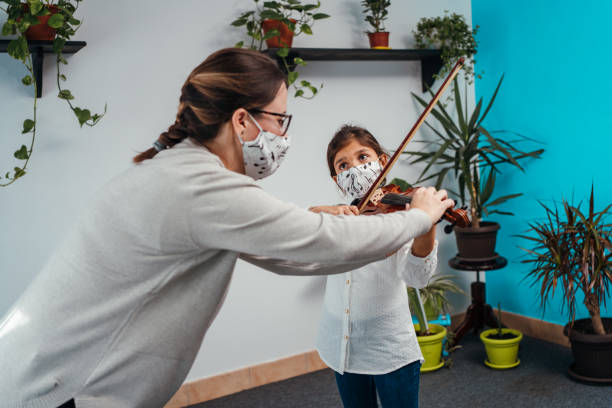 istock Violin class during corona virus pandemic 1284198700