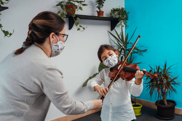 istock Violin class during corona virus pandemic 1284198707
