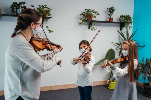 istock Violin class during corona virus pandemic 1284198743