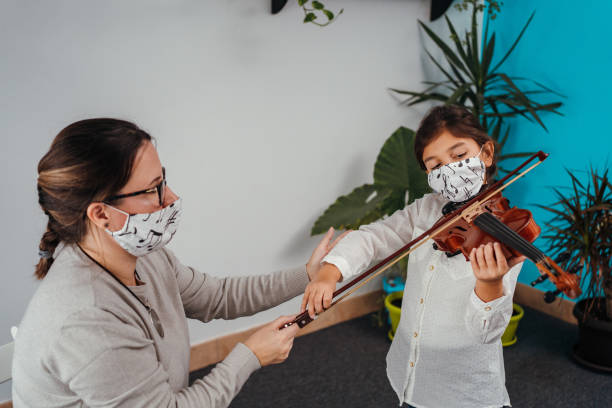 istock Violin class during corona virus pandemic 1284198768