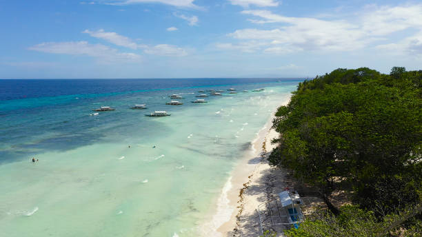istock Sandy beach and tropical sea. Panglao island, Philippines 1284198810