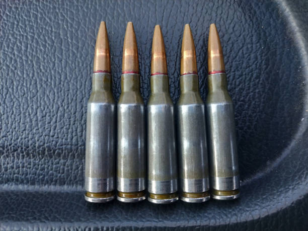 istock Cartridges from a Kalashnikov assault rifle close-up. 1284198865