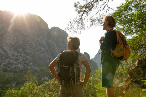 istock Hikers relax in lush jungle in the morning 1284199112