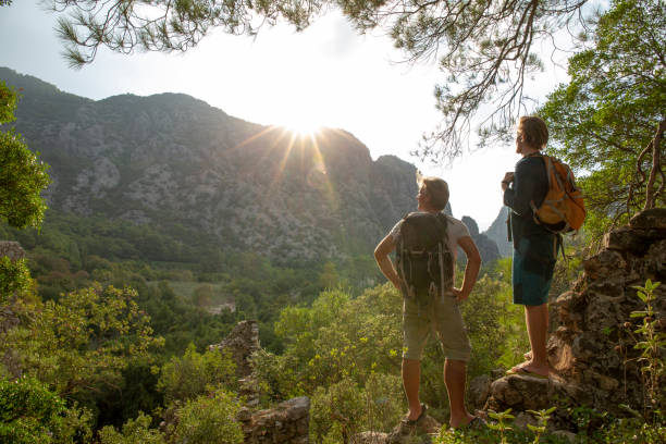 Hikers relax in lush jungle in the morning