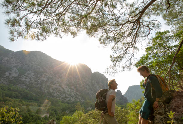 istock Hikers relax in lush jungle in the morning 1284199920
