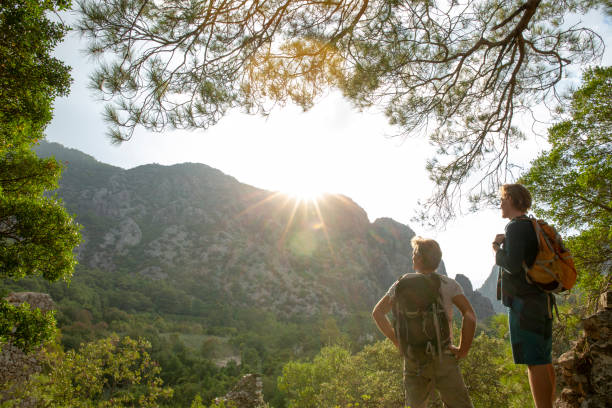 istock Hikers relax in lush jungle in the morning 1284199978