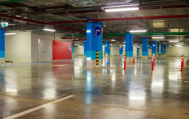 istock Empty parking garage underground interior in apartment or in supermarket 1284200014