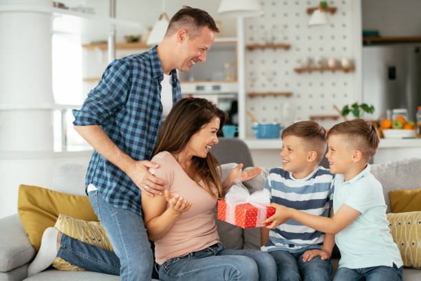 istock Mother is surprised to receive a present from sons 1284200181