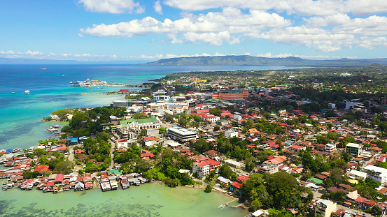 Panorama of the city of Tagbilaran against the background of the sea and mountains. View from above Bohol province,Tagbilaran city.