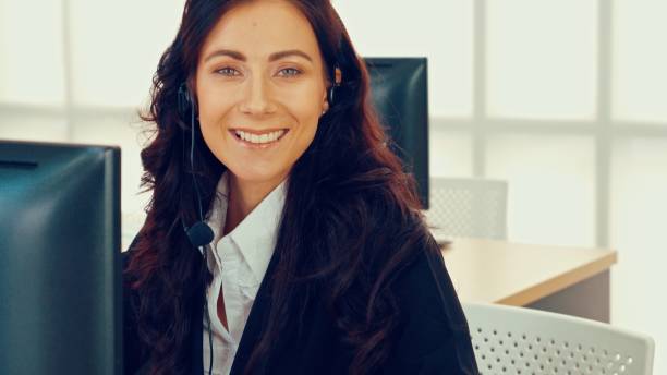 istock Business people wearing headset working in office 1284205547