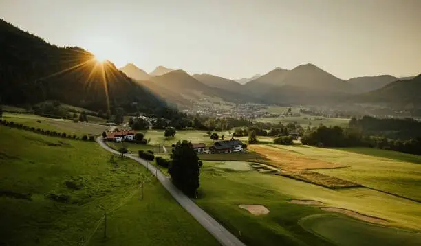 Aerial drone shot from a sunrise in the mountains of Kössen, Tyrol Austria