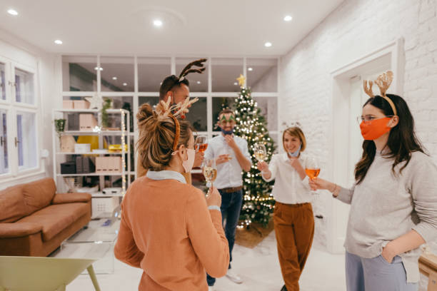 istock Christmas celebration in the office during Coronavirus pandemic 1284214854