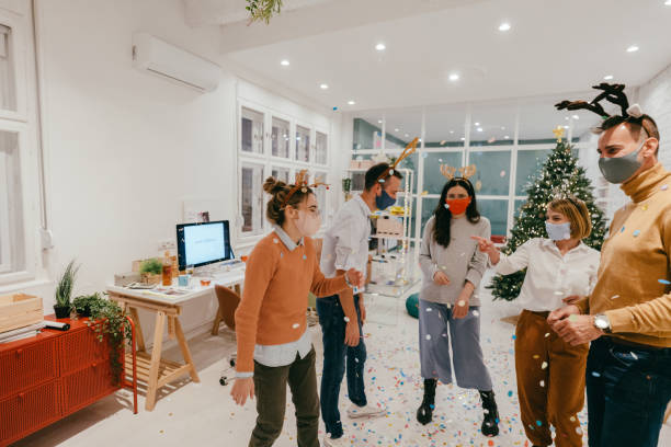 istock New Year's celebration in the office during Coronavirus pandemic 1284216206