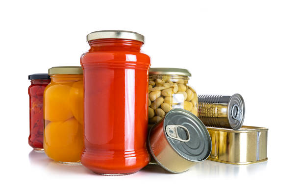 istock Preserved food: glass jars and metal tins isolated on white background 1284217021