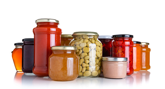 Preserved food: front view of several glass jars isolated on white background. High resolution studio digital capture taken with SONY A7rII and Zeiss Batis 40mm F2.0 CF lens