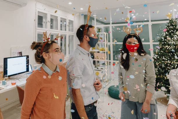 istock New Year's celebration in the office during Coronavirus pandemic 1284217082