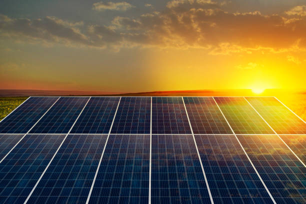 istock Sunset rays over a photovoltaic power plant 1284222088
