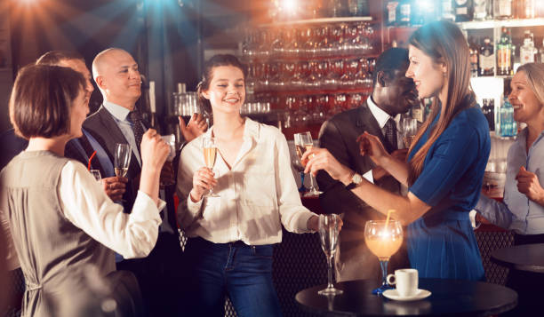 istock Two smiling girls drinking cocktails 1284223167