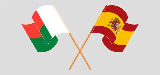 Vector illustration of Crossed and waving flags of Madagascar and Spain