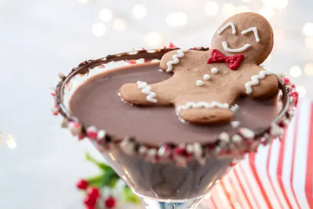 Drunken Gingerbread cookie man in a Christmas cocktail