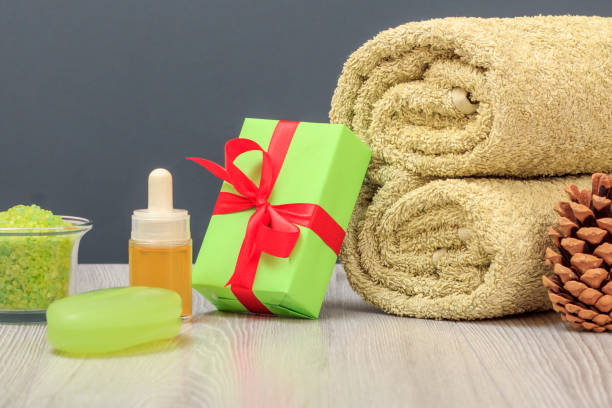 istock Spa composition with towel, gift box, oil, sea salt and soap. 1284231241