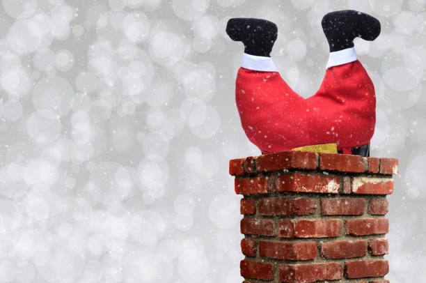 istock Santa Claus upsidedown in a chimney 1284232454