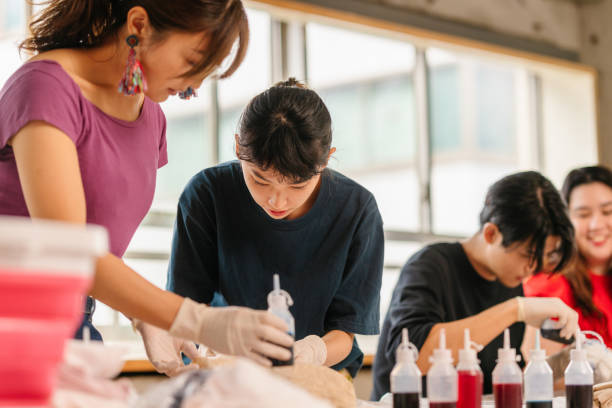 istock Group of people making tie dye together 1284234529