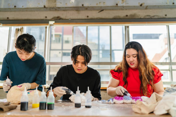istock Group of people making tie dye together 1284235538