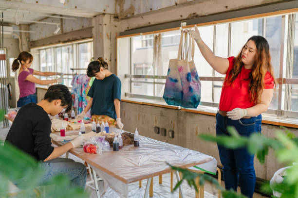 istock Group of people making tie dye together 1284236031