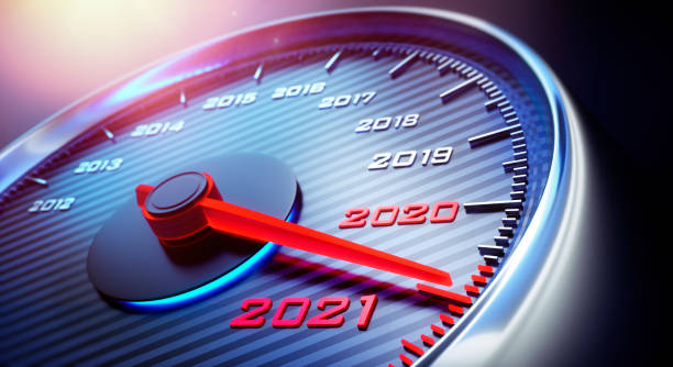 Speedometer 2020 2021 Dark stylish speedometer with needle moving to the year 2021 speedometer photos stock pictures, royalty-free photos & images